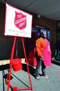 Salvation Army volunteer Yvonne Weatherspoon stands outside of the Navarre Winn Dixie while ringing the iconic bell in an effort to raise money to help those in the local community.  (Photo by Mat Pellegrino | South Santa Rosa News)