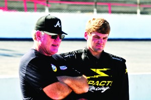 Snowball Derby entrant Kyle Grissom is seen talking to his father Steve, a former 300 lap event winner at Five Flags Speedway and the 1993 Xfinity Series Champion, about the set up of the Super Late Model in advance of this weekend’s Snowball Derby. (Photo by Bill Gamblin | SSRN)