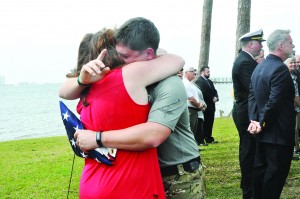 Founder of the Marine Raider Memorial March, Nathan Harris, hugs Leadership Santa Rosa Class 29 member Michele Tucker after receiving a memorial flag he promised to take with him on a 770-mile trek from Navarre to Camp Lejeune, N.C. (Photo by Mat Pellegrino | South Santa Rosa News)