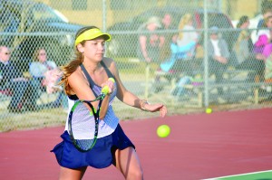 Gulf Breeze’s Mary Miles Hitchcock works her magic on the tennis court last Monday where her team faced the Pace High School Patriots. (Photo by Christian Graves | South Santa Rosa News)