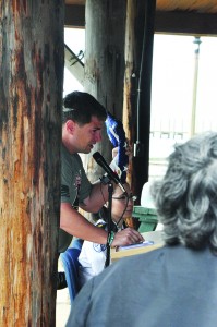 An emotional Harris accepts the flag during Friday’s ceremony in Navarre Park. (Photo by Mat Pellegrino | South Santa Rosa News)