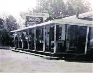 This historical photo of the Jot ‘em Down store is hung up inside Navarre Lumber located on Highway 87S in Navarre. (Photo by Romi White | South Santa Rosa News)