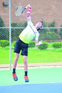 Dolphin Hayden Essary serves the ball to Michael Berryman in Tuesday’s No. 1 singles championship. (Photo by Christian Graves | South Santa Rosa News)