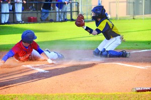 Bartlett’s Barrett Taylor tries to slide home but is tagged out by Dolphin catcher Derrick Whited. (Photo by Christian Graves | South Santa Rosa News)