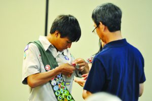 Eagle Scout William Nguyen looks at his Eagle Scout pin during the Court of Honor Ceremony last Saturday. (Photo by Mat Pellegrino | South Santa Rosa News) 