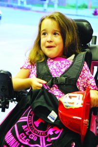 McKinzie Snead was all smiles inside the Holley-Navare Fire Station on Esplanade Street last Tuesday night. (Photo by Mat Pellegrino | South Santa Rosa News)