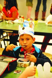 Lucas Levvsque enjoys a treat out of his own lunch box before chowing down on turkey last Wednesday at HNPS. (Photo by Mat Pellegrino | South Santa Rosa News)