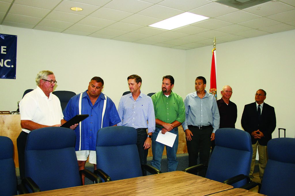 HolleyNavarre Water System board attempts to remove director South